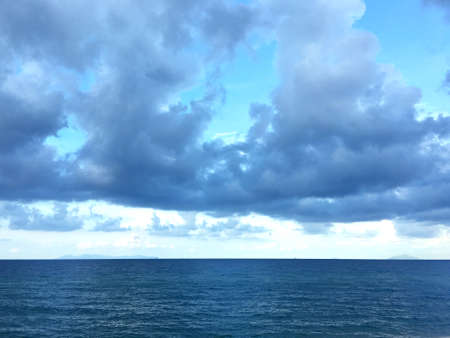 Cloudy sky over the oceanの写真素材