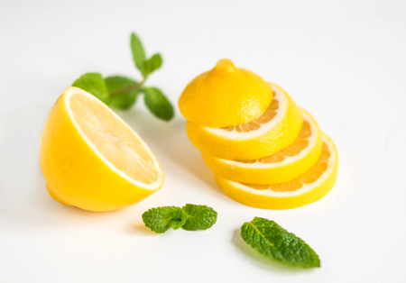 Lemon with mint on a white background. Healthy food products. Vitamin C.の写真素材