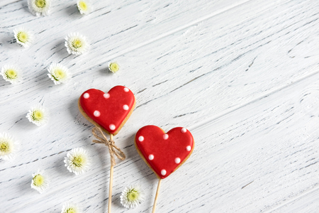 Hearts on a white wooden background. Background for Valentine's Day. Background for a banner with hearts for girls.の写真素材