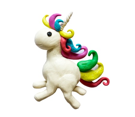Photo of a unicorn made of clay. Unicorn plasticine isolated on a white background.の写真素材