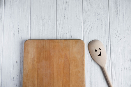 Space for text in the form of an old kitchen board on a white wooden background. Frame for text. Kitchen frame for text.の写真素材