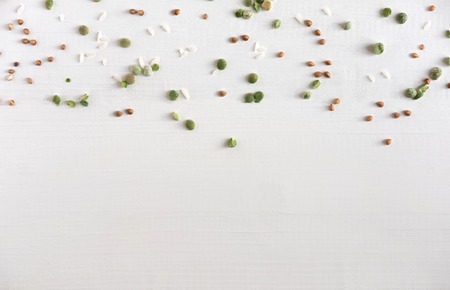 Pattern with buckwheat, wheat, peas and rice on a white background. Pattern with healthy foodの写真素材
