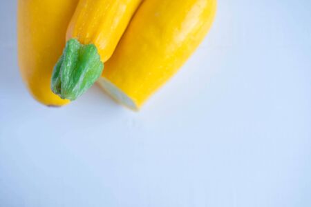 Background for a banner with yellow zucchini close-up. Organic products for vegetarians, raw foodists.の写真素材