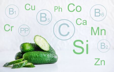 Photo of green cucumbers with vitamins and minerals. Healthy Vitamin Slimming Food.の写真素材