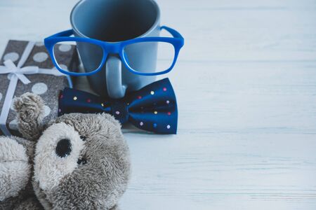 Design for greeting card to boy, guy, teacher, boss for birthday with a place for inscription. Cup, bow tie.の写真素材