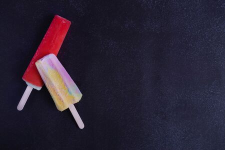 Photo of berry ice cream on a dark background. Dark photo of ice cream. Homemade ice creamの写真素材