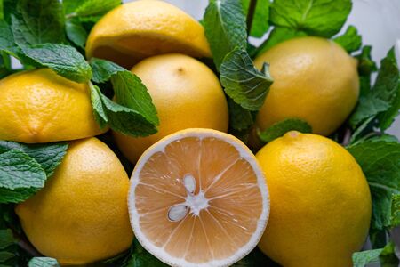 Closeup lemons with mint sliced in half. Fruits with Vitamin C.の写真素材