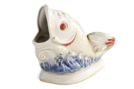 Porcelain figurine of a fish on the waves.の写真素材