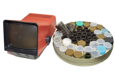 Slide projector with screen and filmstrips in a round boxの写真素材