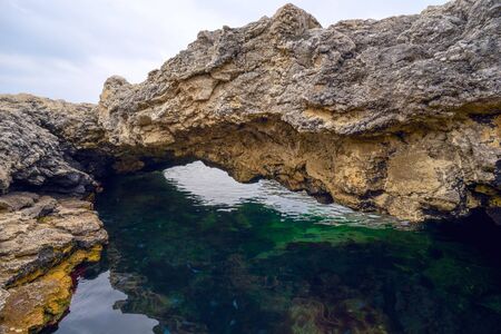Natural pool filled with sea water . Crimea ,a Cup of love.の写真素材