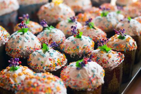 Decorated Easter cakes on the tray for sale.の写真素材