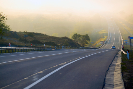 Route A-270 in the area of Novoshakhtinsk in the early morning in the fog. Russia.の写真素材