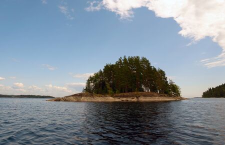 Island with a stone shore on the lake . Ladoga Skerries, Kareliaの写真素材