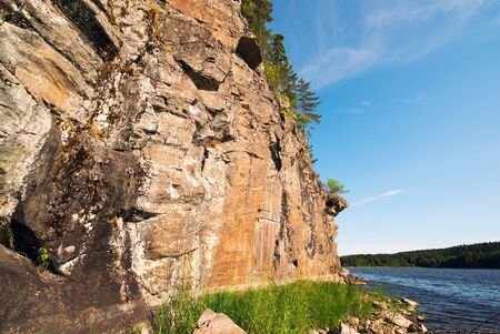 Picturesque stone shore of the island on the lake . Ladoga Skerries, Karelia.の写真素材