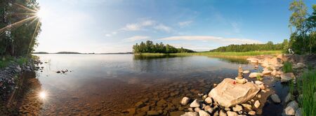Picturesque stone shore of the island on lake Ladoga . Ladoga Skerries, Karelia. Panorama