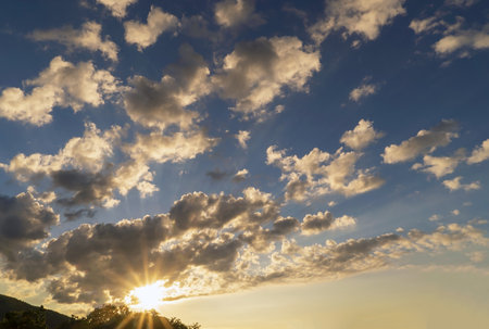 The sun highlights the clouds at sunset over the mountains. Crimea. Choban-kuleの写真素材