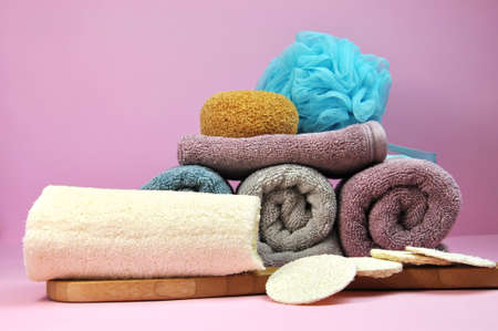 Beauty Spa treatment towels and loofahs, in pink, purple, lavendar and blue accessories.