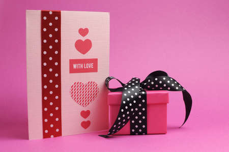 Cute and sassy pink and black polka dot gift with handmade gift card の写真素材