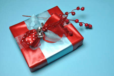 Bright color festive present gift box in blue and red theme の写真素材