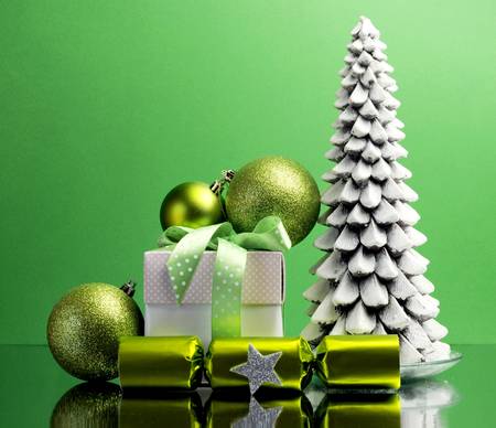 Green theme Christmas tree, gift and bauble decorations festive holiday still life 