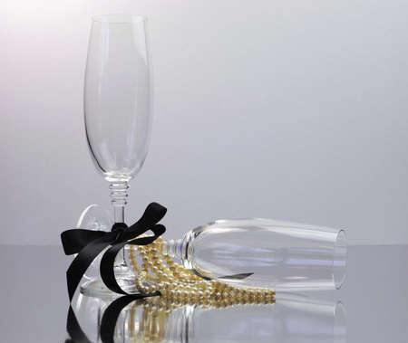 Champagne Glasses for black tie occasion celebration or New Years Eve party in black and white の写真素材