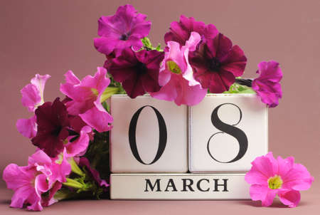 Save the date white block calendar for International Women, with pink and purple flowers on pink purple background の写真素材
