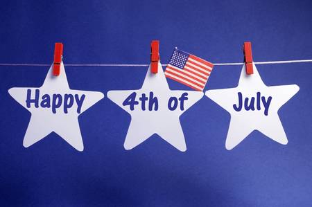 Happy Fourth 4th of July message written across three 3 white stars with USA American flag hanging...