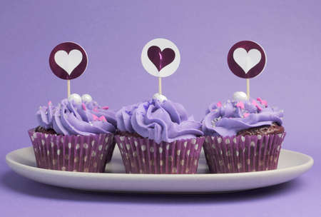 Mauve purple decorated cupcakes for children or teens birthday, or bachelorette, bridal or baby shower party function の写真素材