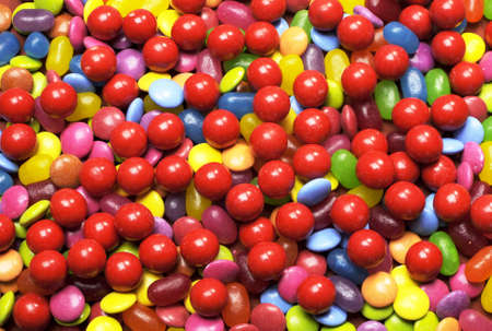 Bright colorful background abstract of multi-colored candy lollies and sweets for Halloween or...