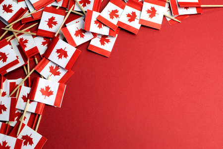 Abstract background of Canada red and white Maple Leaf national toothpick flags for national emblem or public holiday event, with copy space for your text here の写真素材