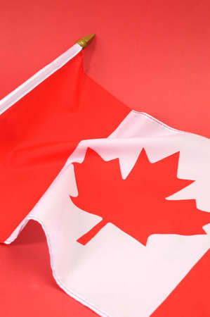 Background close up of Canadian Maple Leaf red and white  flag for national public holiday event.の写真素材