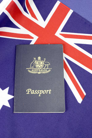 Close up of Australian Southern Cross flag with Australian passport for Australian travel eventの写真素材