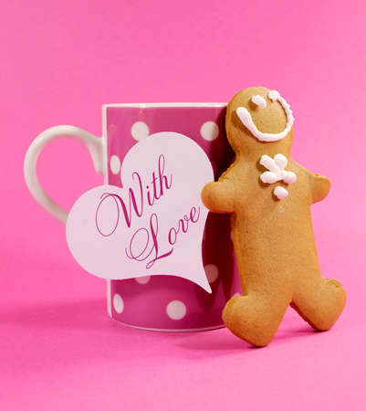 Merry Christmas ginger bread man with pink polka dot cup of coffee or tea mug and heart gift tag...