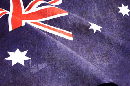 Grunge distressed aged old Australian flag for Anzac Day, 70th anniversary WWII, or 100th anniversary start of WWI events の写真素材