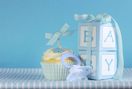 Blue theme baby boy cupcake with dummy pacifier and gift boxes 