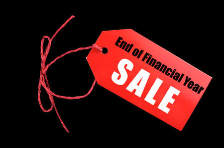 End of Financial Year red ticket sale tag against a black background.の写真素材