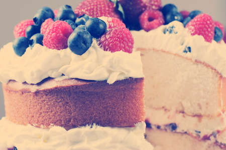 Sponge Layer Cake with fresh whipped cream, raspberry jelly and raspberries, strawberries and...
