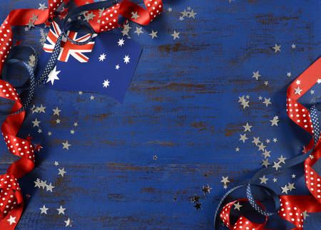 Happy Australia Day, January 26, theme dark blue vintage distressed wood background with Australian flag and decorations with copy space for your text here.の写真素材