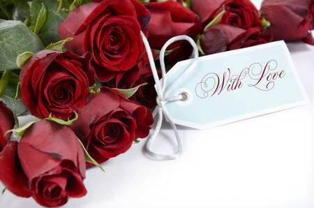 Happy Valentines Day bouquet of red roses on white background and With Love greeting tag card. .の写真素材