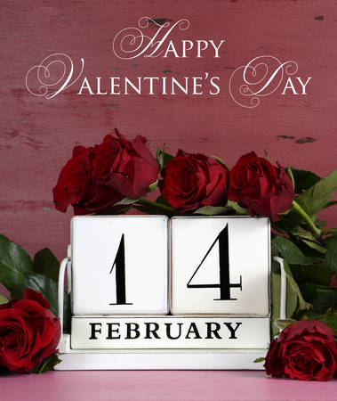 Happy Valentine Day vintage wood calendar for February 14 on red and pink vintage wood background with bouquet of red roses, vertical with sample text.の写真素材