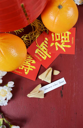 Happy Chinese New Year celebration party table on red wood background.の写真素材