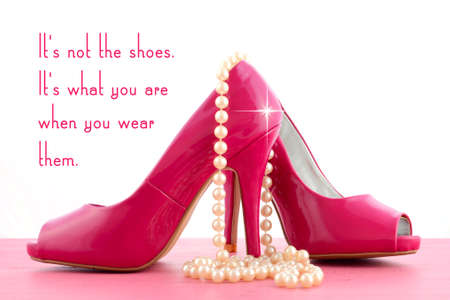High Heel Shoe with cute inspiration and funny quotation on pink wood table.の写真素材