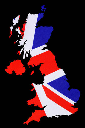 Map of Great Britain cut out with UK British Union Jack flag on black background.の写真素材