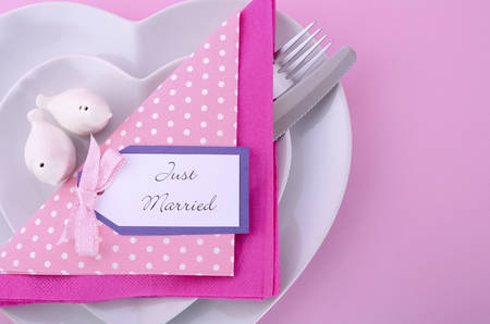 Modern Wedding Table Place Setting with Heart Shape Plates on Pink Table Background.の写真素材