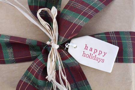 Vintage style Christmas gift on dark wood background.の写真素材