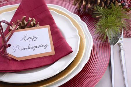 Traditional red theme festive table place setting for Thanksgiving dinner party table.の写真素材