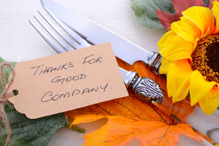 Happy Thanksgiving white wood background with decorated borders of leaves and sunflowers, with closeup on details.の写真素材