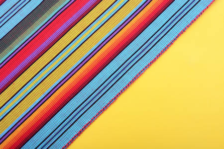 Cinco de Mayo festive stripe material on yellow background, with copy space.の写真素材