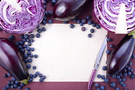 Purple fruits and vegetables thay contain Anthocynins, found in the Okinawan diet, that maintain healthy blood vessels and promote longevity, with copy space.の写真素材