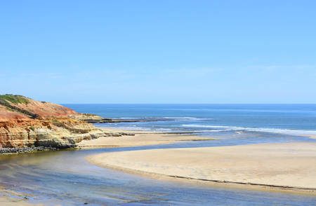 Beautiful scenic coastline estuary where Onkaparinga River flows into the ocean at Port Noarlunga, South Australia.の写真素材